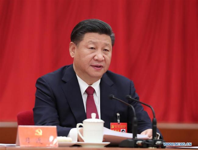 Xi Jinping presides over the first plenary session of the 19th Communist Party of China (CPC) Central Committee at the Great Hall of the People in Beijing, capital of China, Oct. 25, 2017. [Photo: Xinhua]